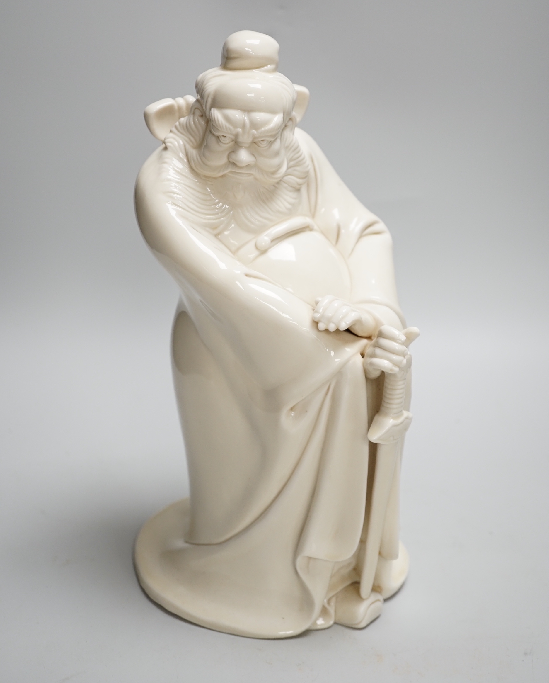 A large Chinese blanc de chine of Zhong Kui, the Devil Chaser, probably Republic, seal mark to the reverse, 30cm high